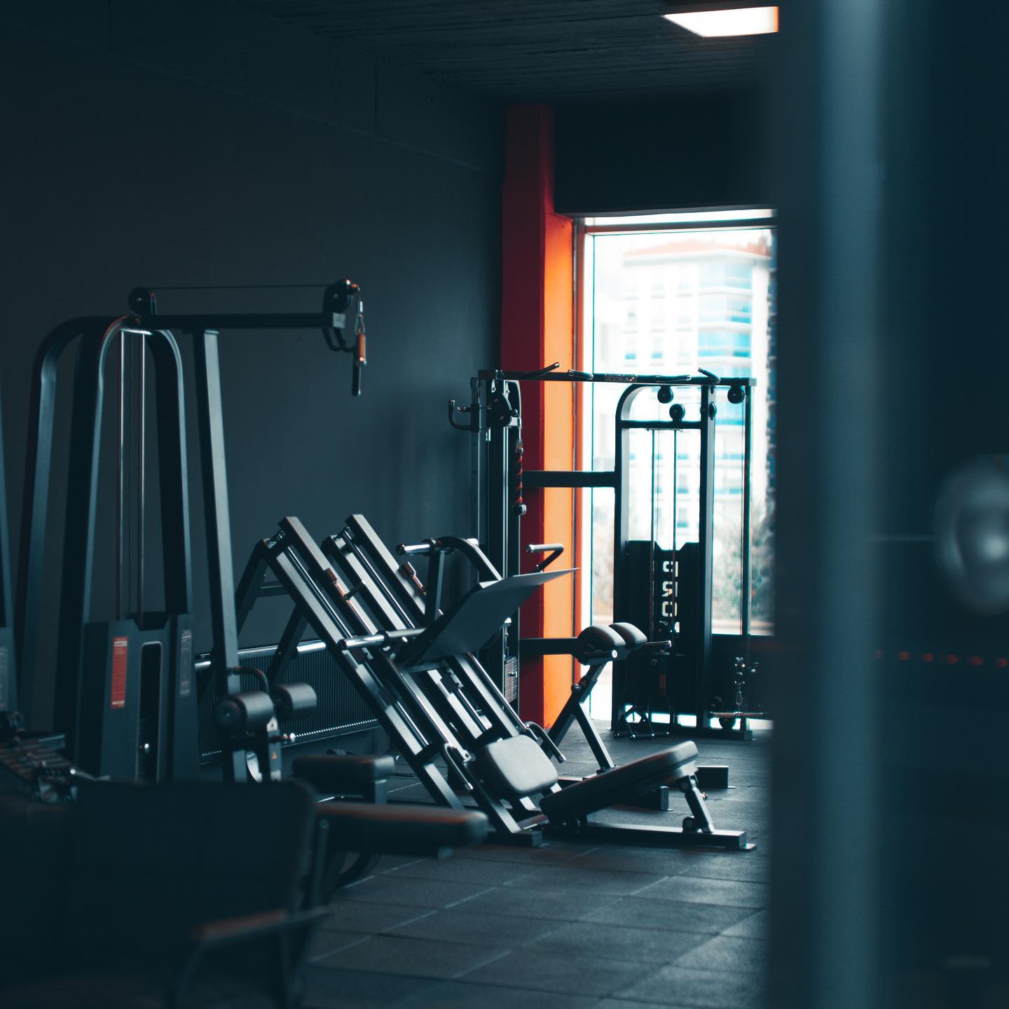 Functional training area with kettlebells and battle ropes